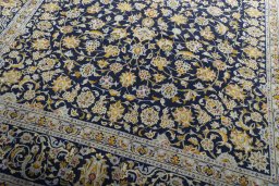 Close-up detail of 2000s Kashan rug from Iran / Persia showing Wool weave