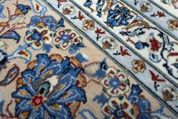 Surface texture of 2000s Kashan rug with natural Wool and intricate pattern