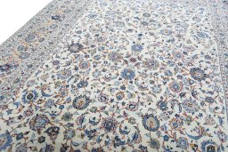 Backside of handmade 2000s Kashan rug showing knot structure and weave density