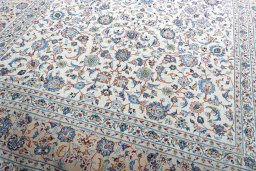 Close-up detail of 2000s Kashan rug from Iran / Persia showing Wool weave