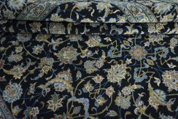 Close-up detail of 2000s Kashan rug from Iran / Persia showing Wool weave