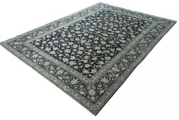 Corner detail of 2000s Kashan rug showing border pattern and Wool pile
