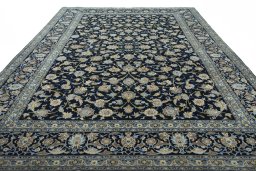 Surface texture of 2000s Kashan rug with natural Wool and intricate pattern