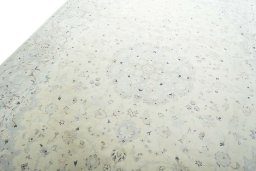 Backside of handmade New Kashan rug showing knot structure and weave density