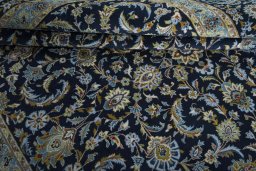 Close-up detail of 2000s Kashan rug from Iran / Persia showing Wool weave