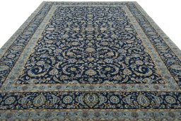 Surface texture of 2000s Kashan rug with natural Wool and intricate pattern