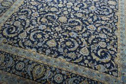 Close-up detail of 2000s Kashan rug from Iran / Persia showing Wool weave