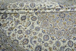 Close-up detail of 2000s Kashan rug from Iran / Persia showing Wool weave