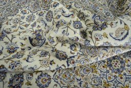 Surface texture of 2000s Kashan rug with natural Wool and intricate pattern