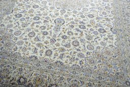 Close-up detail of 2000s Kashan rug from Iran / Persia showing Wool weave