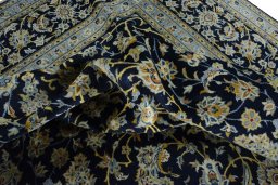 Surface texture of 2000s Kashan rug with natural Wool and intricate pattern