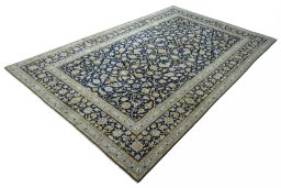 Corner detail of 2000s Kashan rug showing border pattern and Wool pile