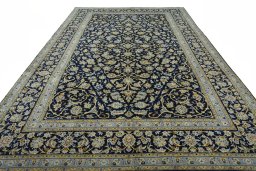 Surface texture of 2000s Kashan rug with natural Wool and intricate pattern