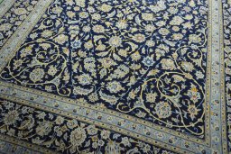 Close-up detail of 2000s Kashan rug from Iran / Persia showing Wool weave