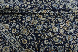 Close-up detail of 2000s Kashan rug from Iran / Persia showing Wool weave