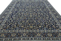 Surface texture of 2000s Kashan rug with natural Wool and intricate pattern