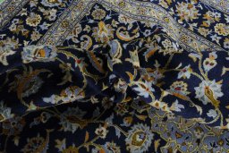 Central medallion detail of 2000s Kashan rug from Iran / Persia
