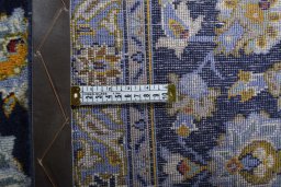 Close-up detail of 2000s Kashan rug from Iran / Persia showing Wool weave