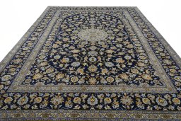 Surface texture of 2000s Kashan rug with natural Wool and intricate pattern