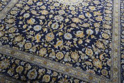 Close-up detail of 2000s Kashan rug from Iran / Persia showing Wool weave
