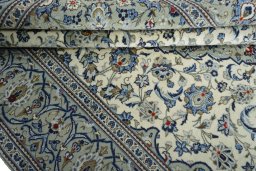 Close-up detail of 2000s Kashan rug from Iran / Persia showing Wool weave