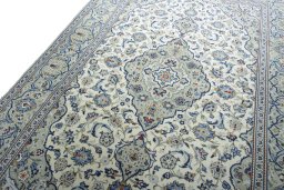 Backside of handmade 2000s Kashan rug showing knot structure and weave density
