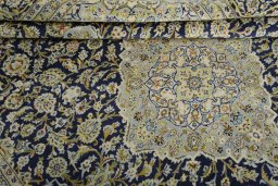 Surface texture of 2000s Kashan rug with natural Wool and intricate pattern