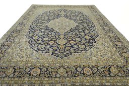 Surface texture of 2000s Kashan rug with natural Wool and intricate pattern