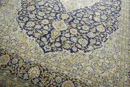 Close-up detail of 2000s Kashan rug from Iran / Persia showing Wool weave