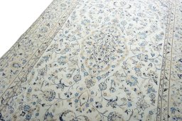 Backside of handmade 2000s Kashan rug showing knot structure and weave density