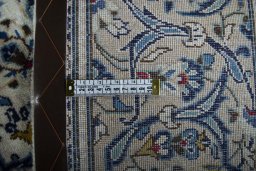 Close-up detail of 2000s Kashan rug from Iran / Persia showing Wool weave