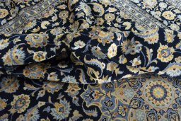 Surface texture of 2000s Kashan rug with natural Wool and intricate pattern