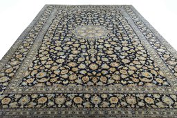 Surface texture of 2000s Kashan rug with natural Wool and intricate pattern