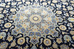Central medallion detail of 2000s Kashan rug from Iran / Persia