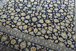 Close-up detail of 2000s Kashan rug from Iran / Persia showing Wool weave