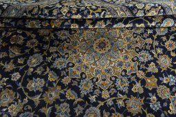Close-up detail of 2000s Kashan rug from Iran / Persia showing Wool weave