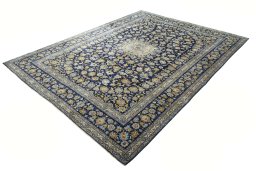 Corner detail of 2000s Kashan rug showing border pattern and Wool pile