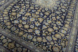 Close-up detail of 2000s Kashan rug from Iran / Persia showing Wool weave