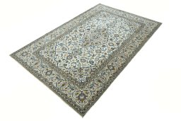 Corner detail of 2000s Kashan rug showing border pattern and Wool pile