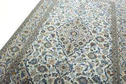 Backside of handmade 2000s Kashan rug showing knot structure and weave density