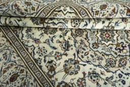 Close-up detail of 2000s Kashan rug from Iran / Persia showing Wool weave