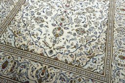 Close-up detail of 2000s Kashan rug from Iran / Persia showing Wool weave