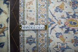Surface texture of 2000s Kashan rug with natural Wool and intricate pattern