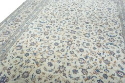 Backside of handmade 2000s Kashan rug showing knot structure and weave density