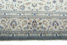 Close-up detail of 2000s Kashan rug from Iran / Persia showing Wool weave