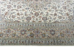 Corner detail of 2000s Kashan rug showing border pattern and Wool pile