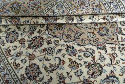 Close-up detail of 2000s Kashan rug from Iran / Persia showing Wool weave