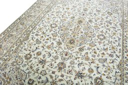 Backside of handmade 2000s Kashan rug showing knot structure and weave density