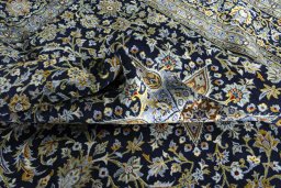 Surface texture of 2000s Kashan rug with natural Wool and intricate pattern