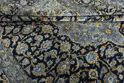 Close-up detail of 2000s Kashan rug from Iran / Persia showing Wool weave